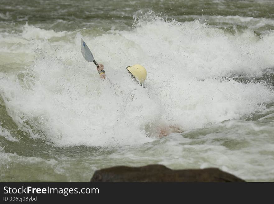 Adventurous Whitewater Kayaker in Rapids