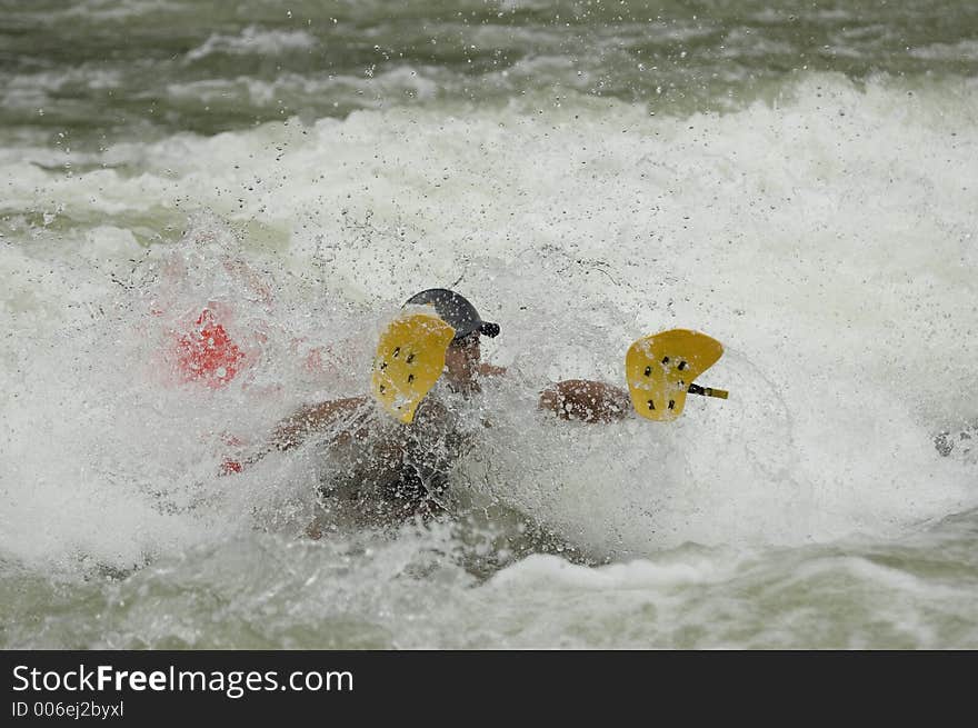 Adventurous Whitewater Kayaker in Rapids