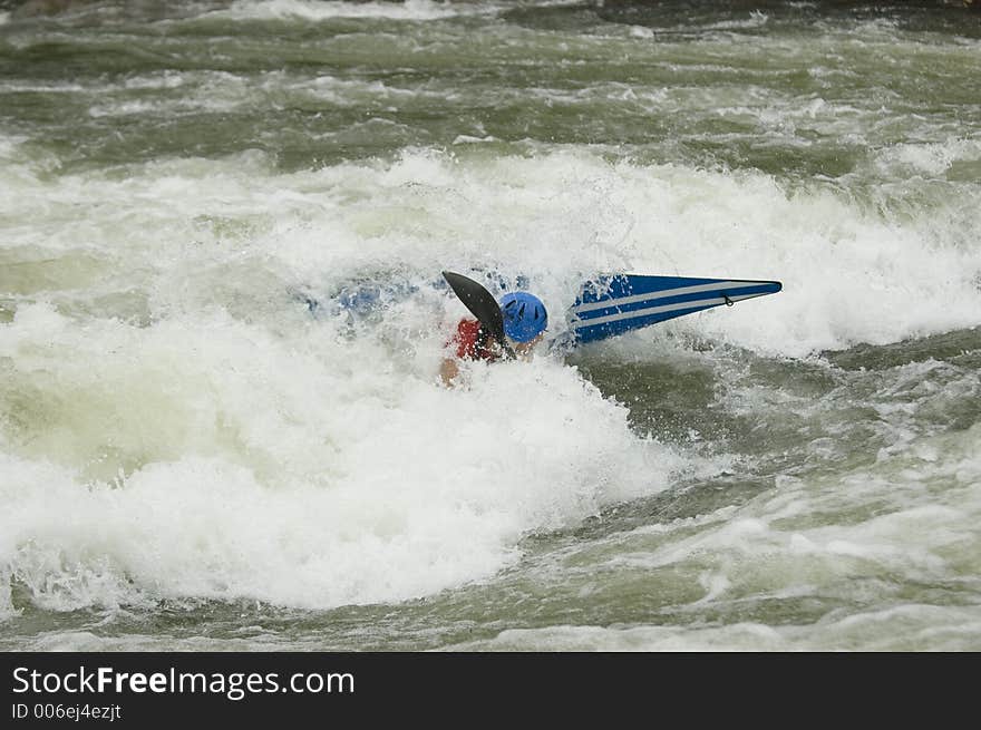 Adventurous Whitewater Kayaker in Rapids