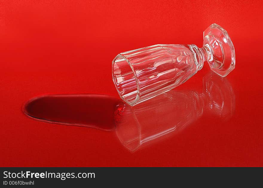 Liqueur glass on red background