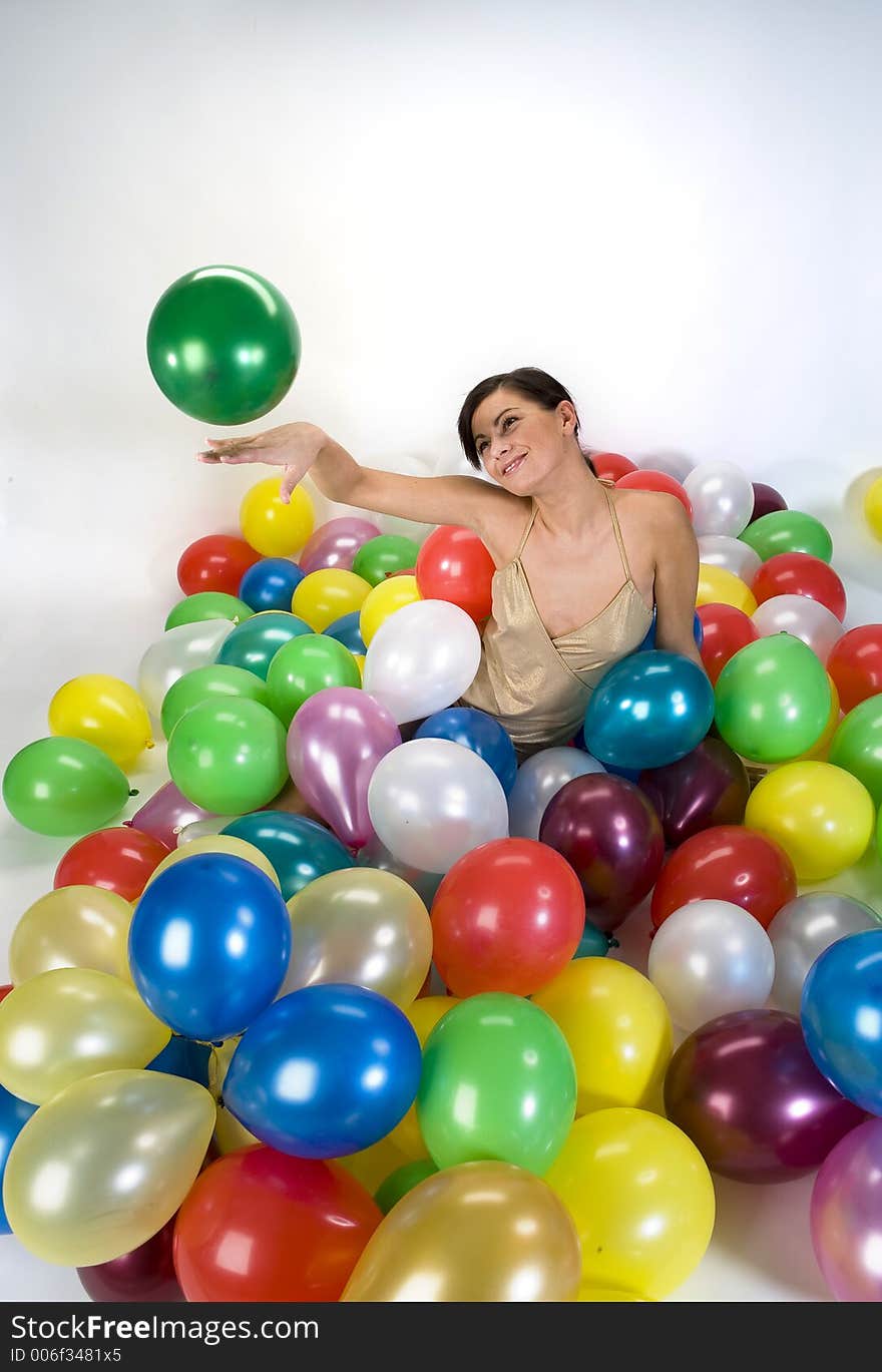 Smiled girl in colorful baloons