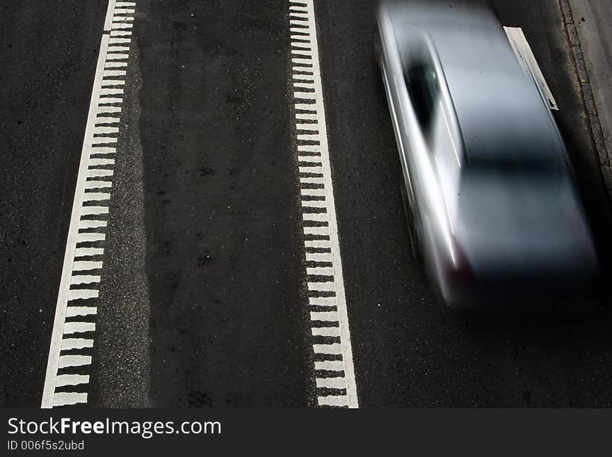 Traffic  on a street in denmark, shot from above (a bridge) with low shutter speed