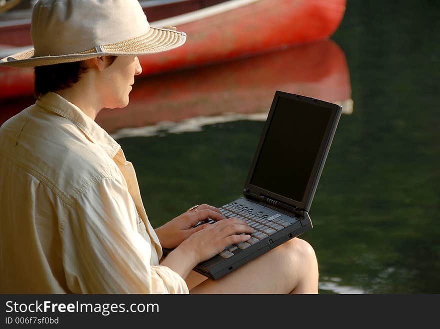 Sitting by a canoe. Sitting by a canoe