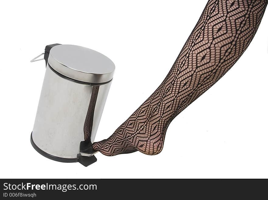 Woman opening dustbin with bare foot. Woman opening dustbin with bare foot