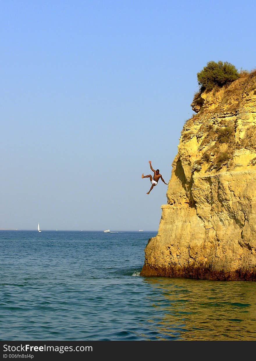 Swimmer in the Batata beach in Algarve Lakes training of fast form divings for the sea. Swimmer in the Batata beach in Algarve Lakes training of fast form divings for the sea.