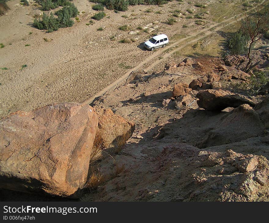 Offroader in a valley in the near of the brandberg in namibia. This is the valley of the desert elephants. Offroader in a valley in the near of the brandberg in namibia. This is the valley of the desert elephants.