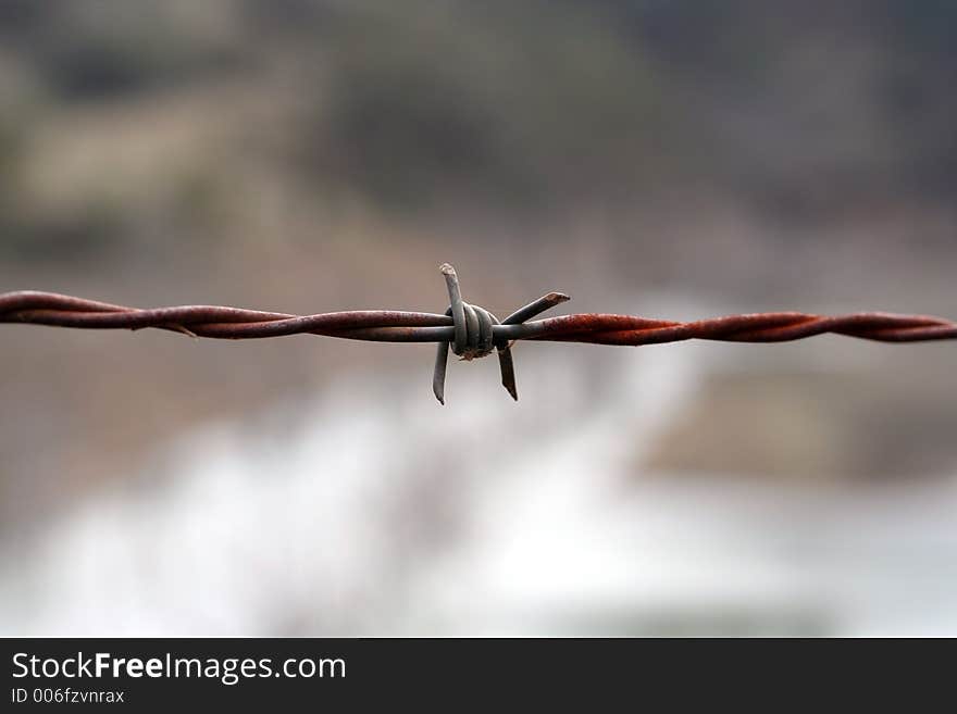 Image of two strands of wire used to keep stock behind a fence. Taken in the Australian bush, west of The Great Dividing Range. Image of two strands of wire used to keep stock behind a fence. Taken in the Australian bush, west of The Great Dividing Range