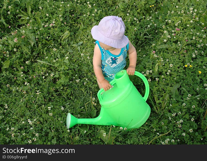 Litlle girl and watering-pot