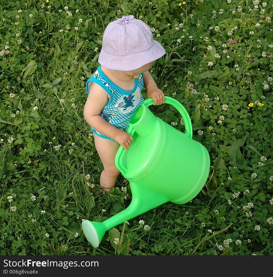 Litlle girl and watering-pot