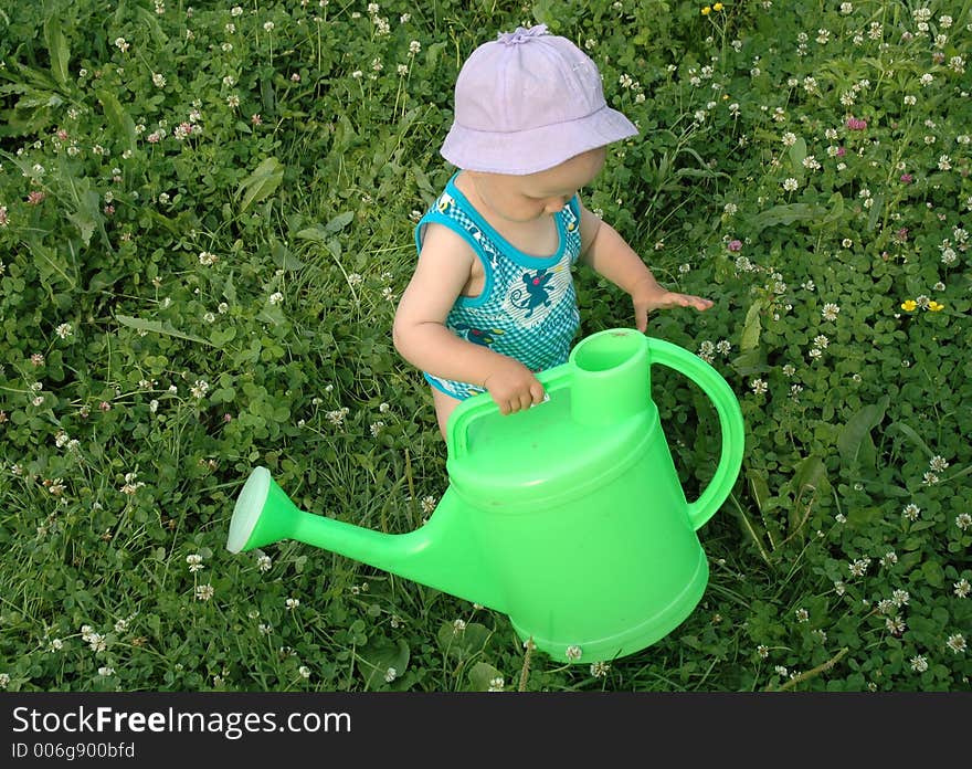 Litlle girl and watering-pot