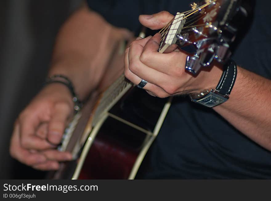 Hands playing guitar, I was playing with DOF