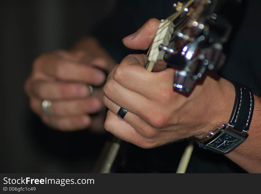 Hands playing guitar, I was playing with DOF