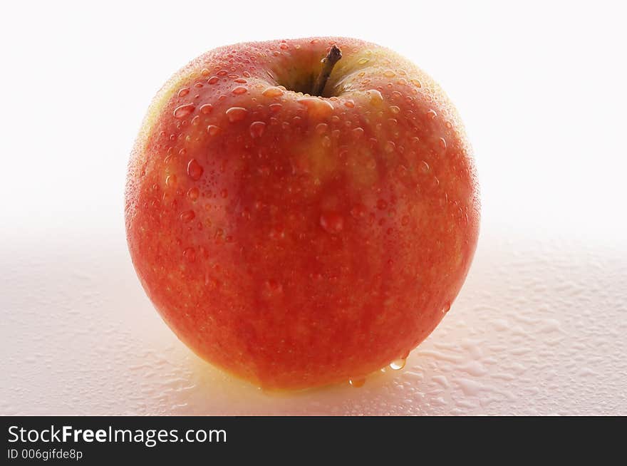 Fresh red apple against a white background