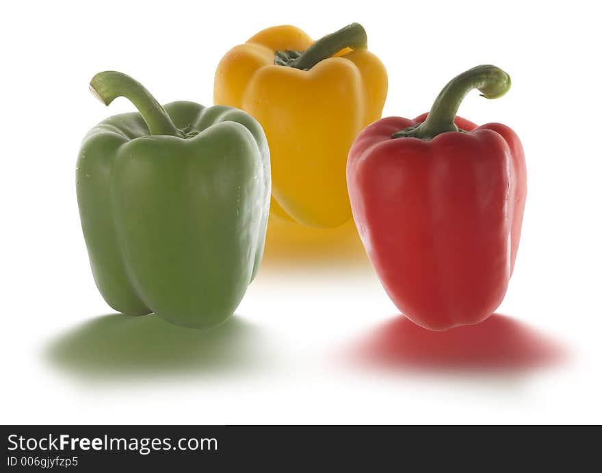 Peppers in different colors isolated on white