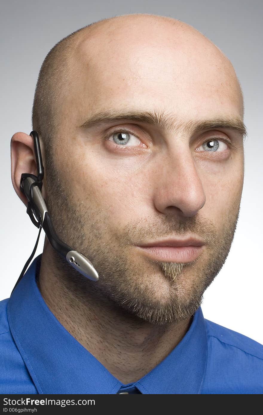 Detail of man with phone headset