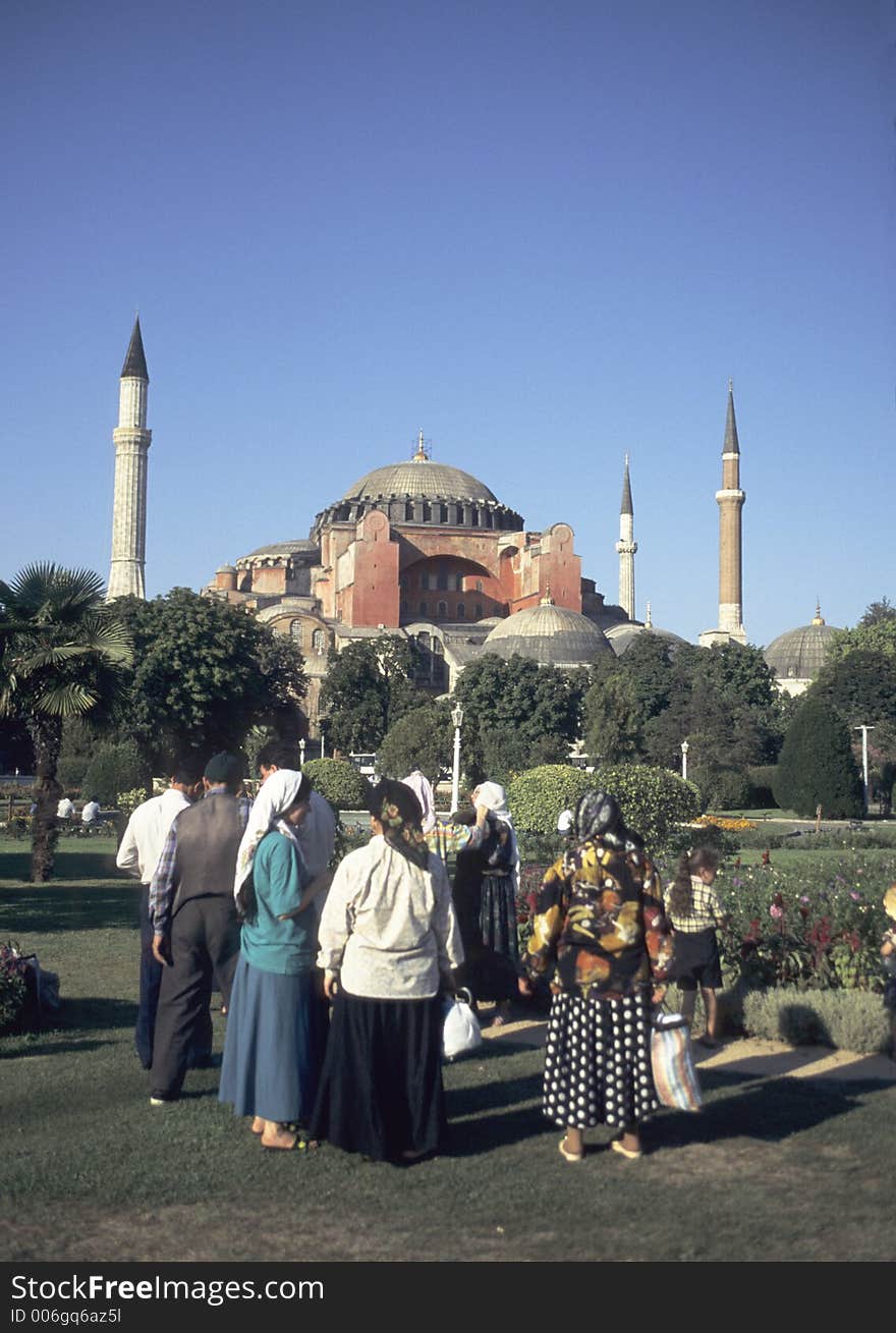 Turkish tourists in the gardens of hagia sophia in istanbul. Turkish tourists in the gardens of hagia sophia in istanbul