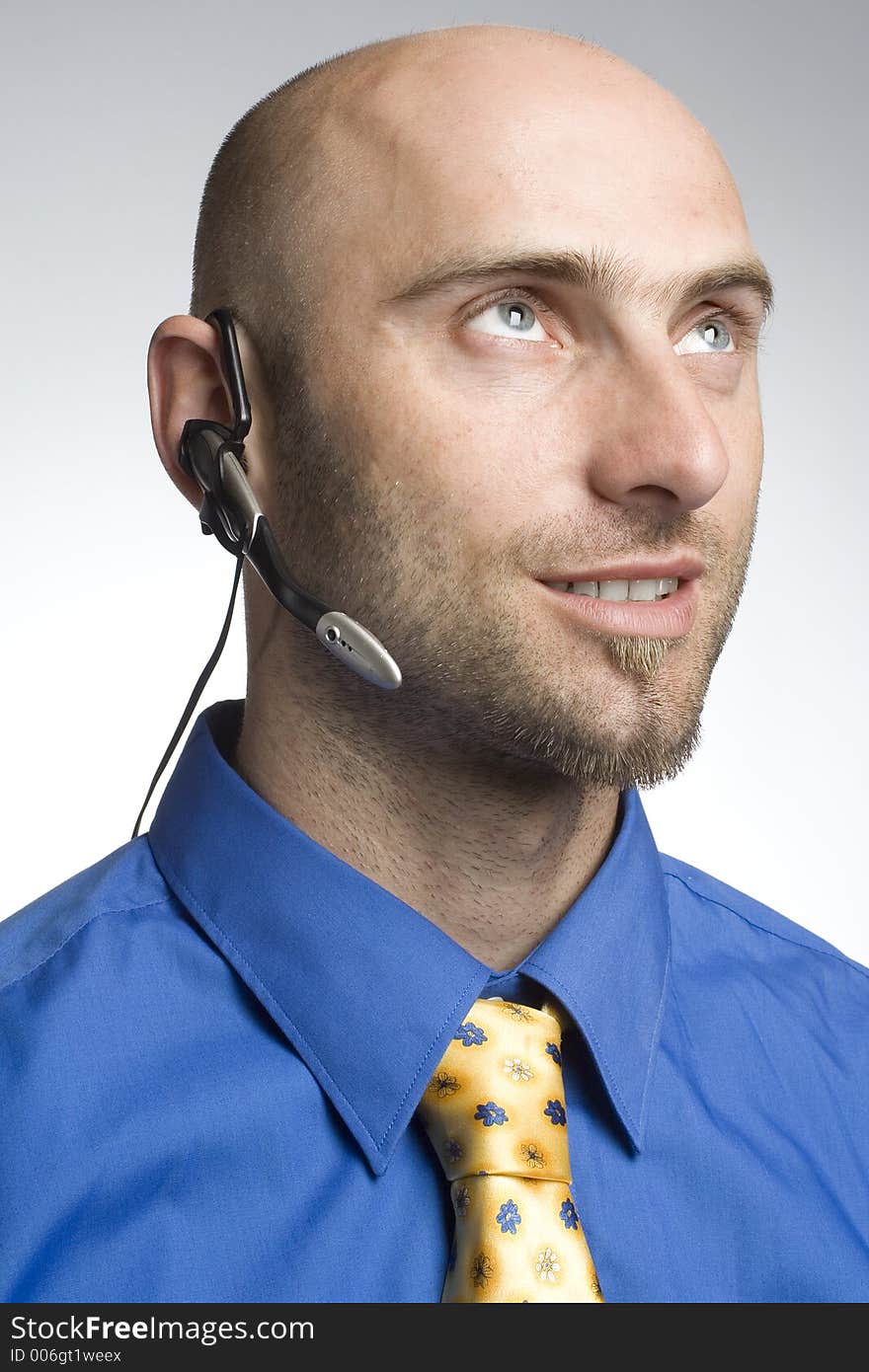 Handsome businessman with phoneheadset. Handsome businessman with phoneheadset