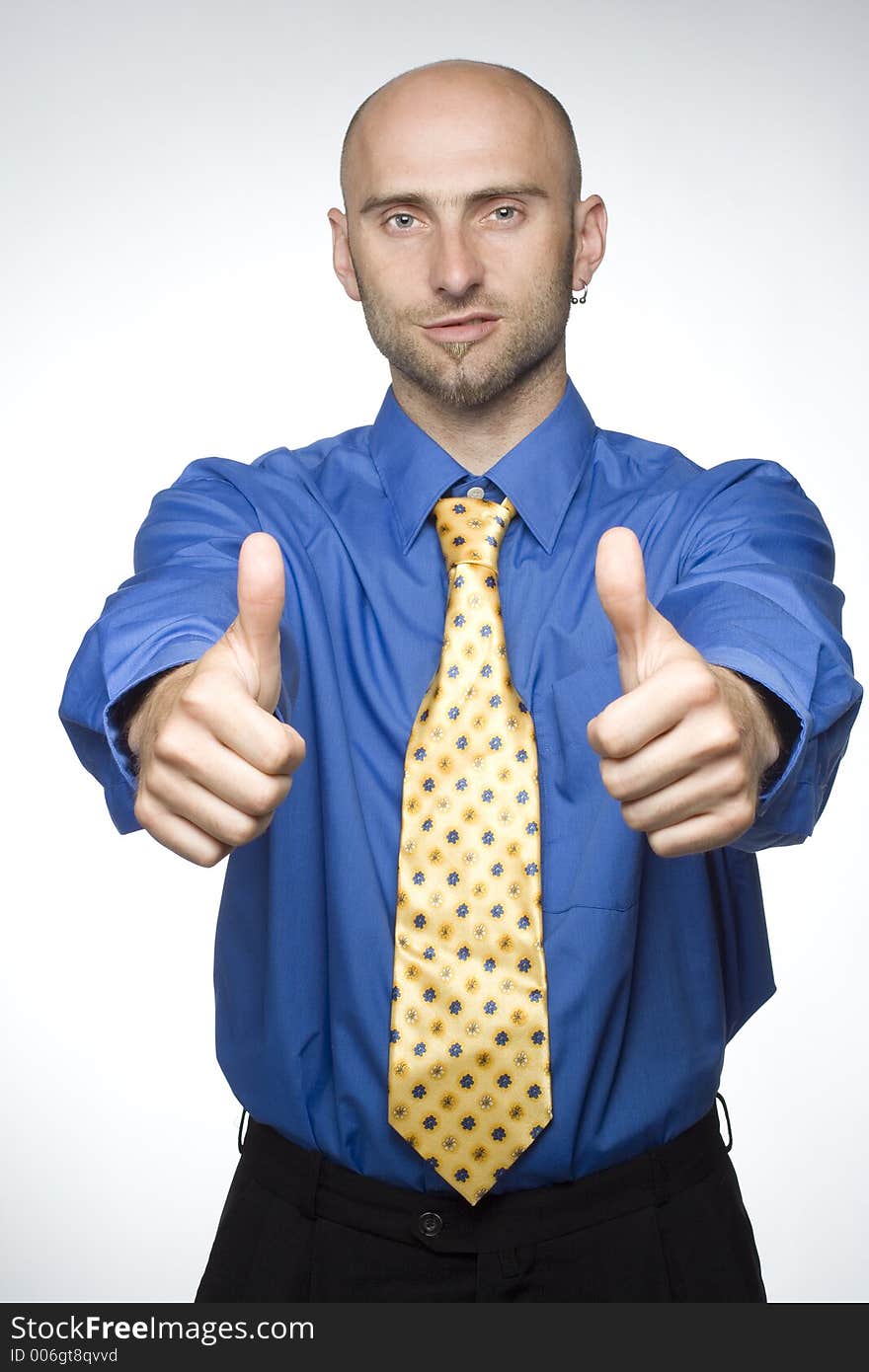 Young businessman with his thumbs up. Young businessman with his thumbs up