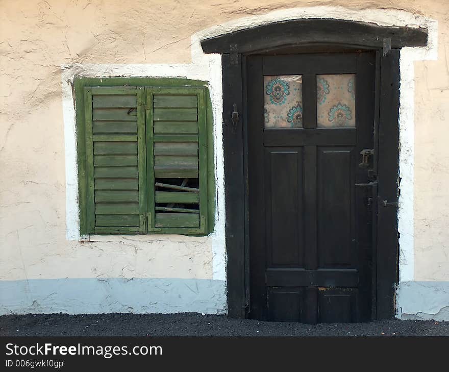 Tiny door and window with green shutters. Tiny door and window with green shutters