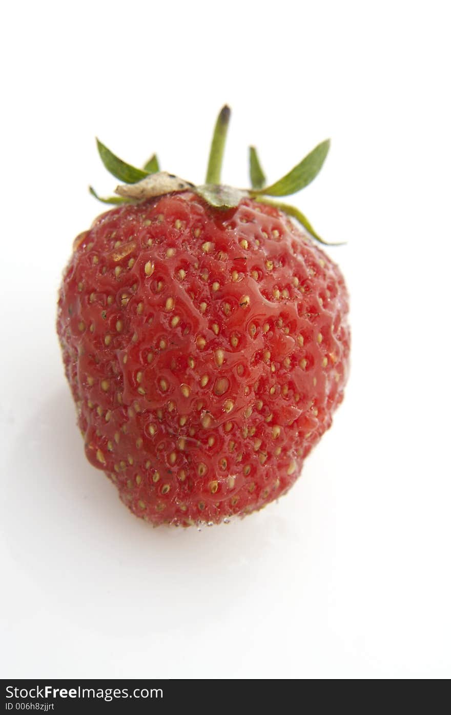 Wet strawberry on white background