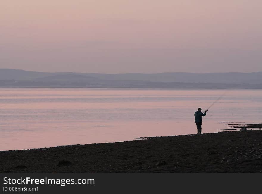 Sea fisherman at dusk