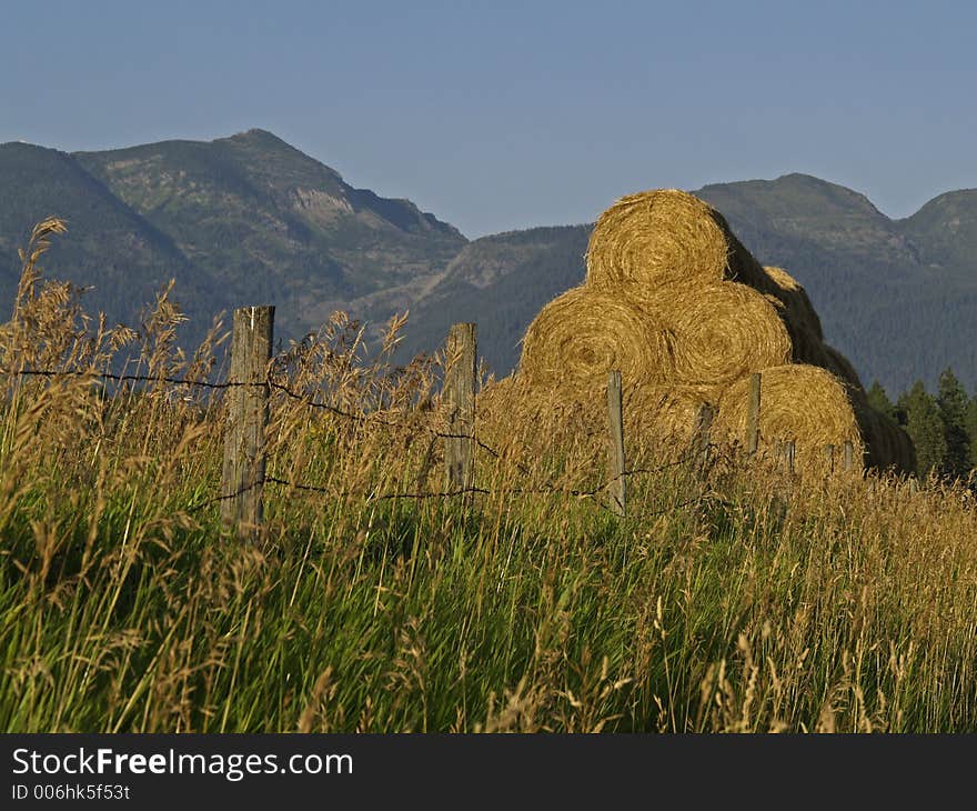 Stacked Hay And Mountains