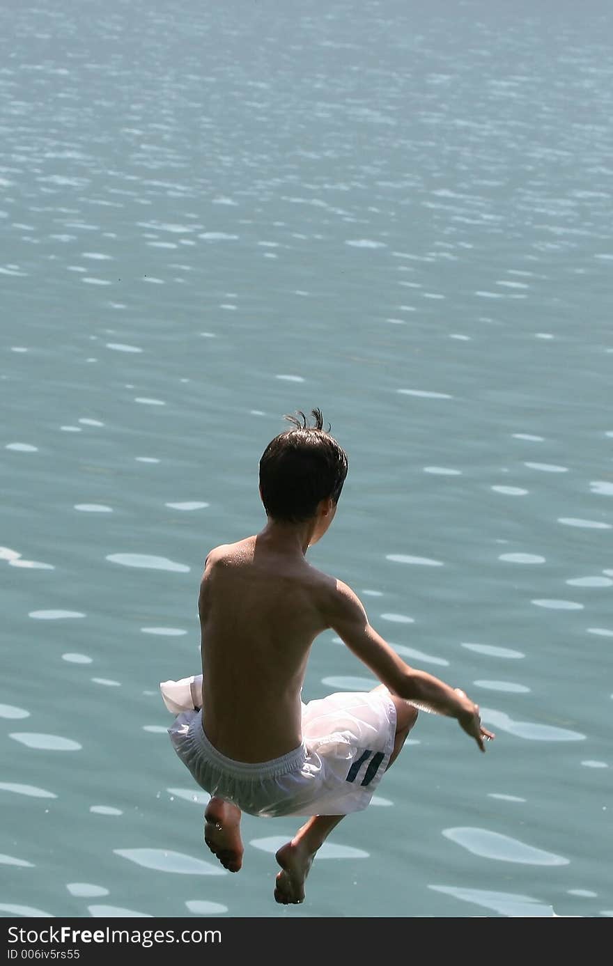 Boy jumping in the lake. Boy jumping in the lake