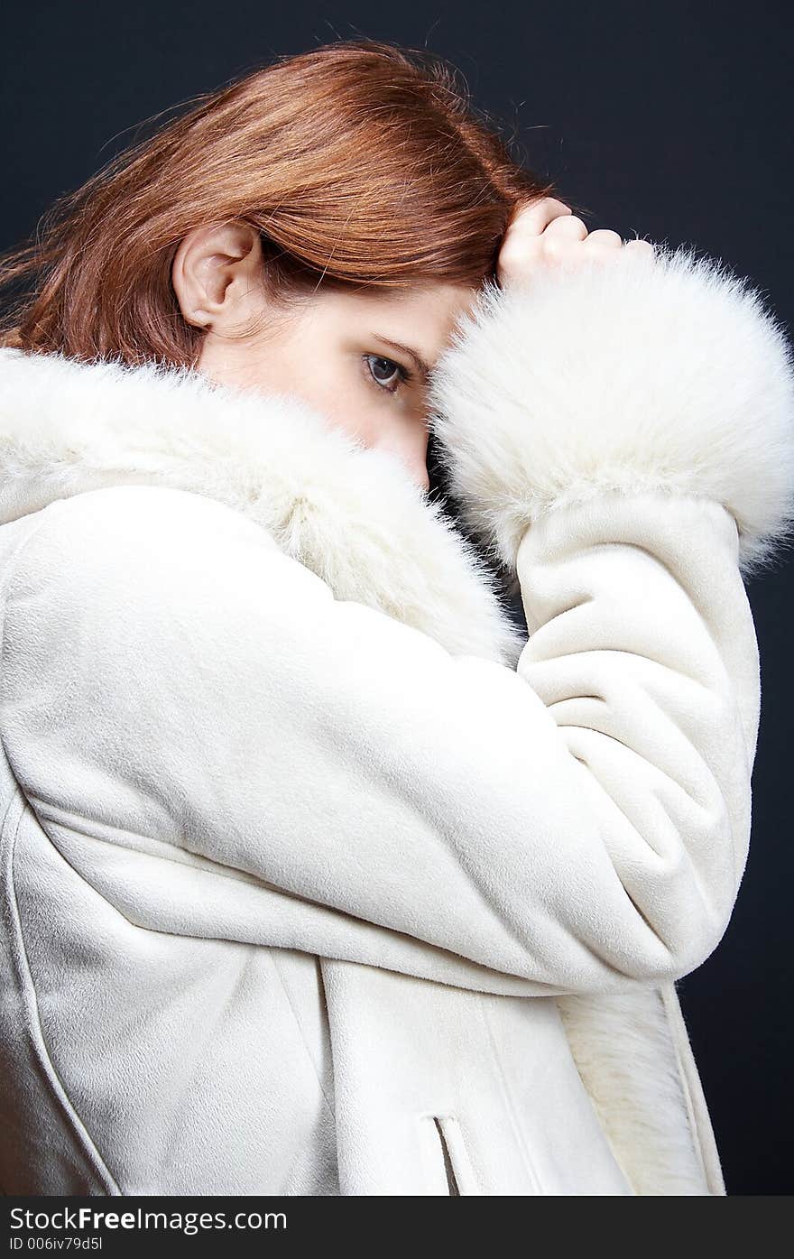 Woman with fur coat on black background. Woman with fur coat on black background