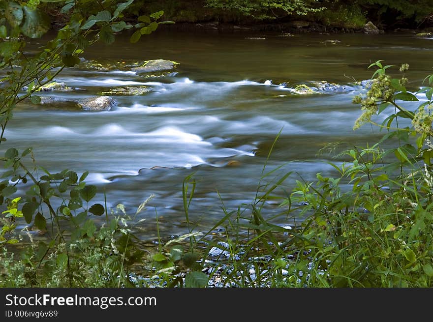 River Ourthe with moving water. River Ourthe with moving water