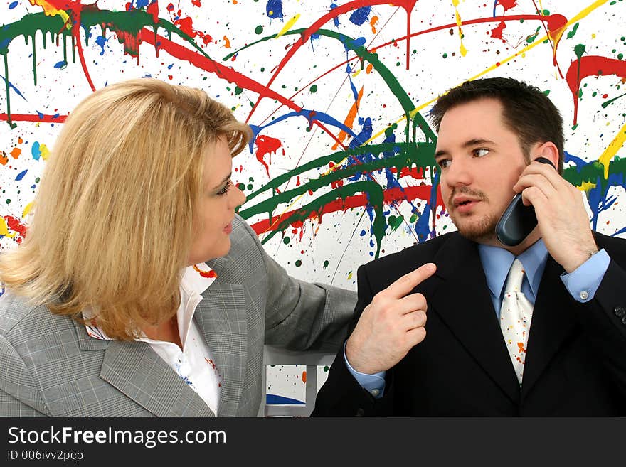 Professional woman and man on business call; paint splash background. Professional woman and man on business call; paint splash background