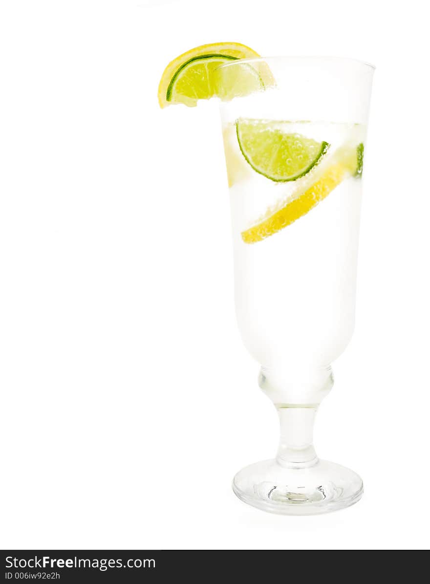 Glass of 7up with lemon and lime isolated on white background