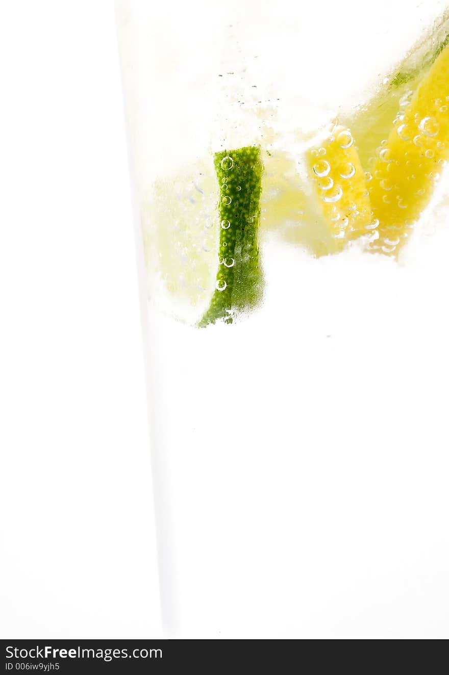 Glass of 7up with lemon and lime isolated on white background