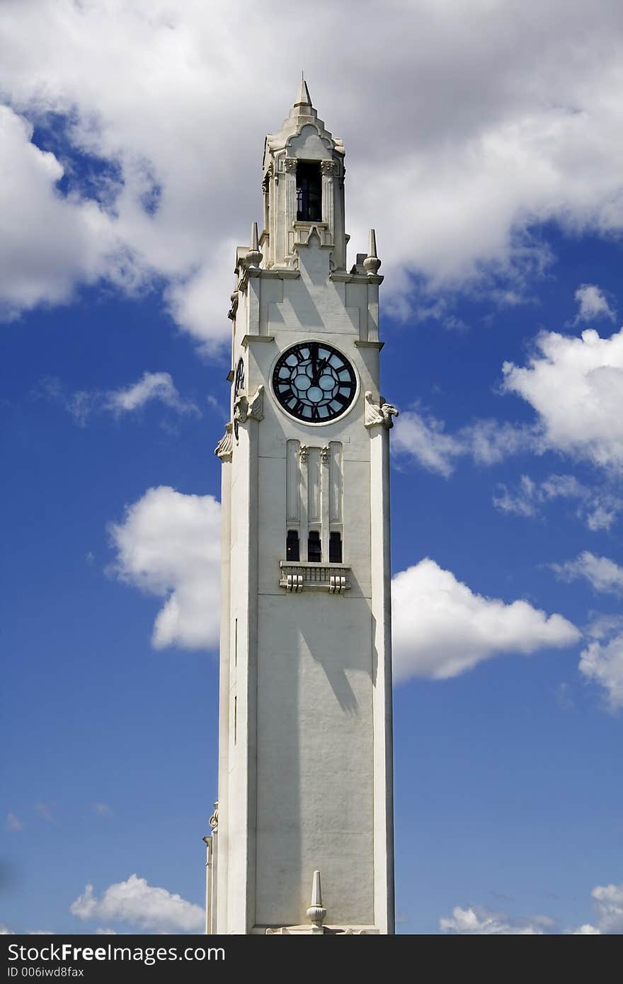 Old clock on a blue sky