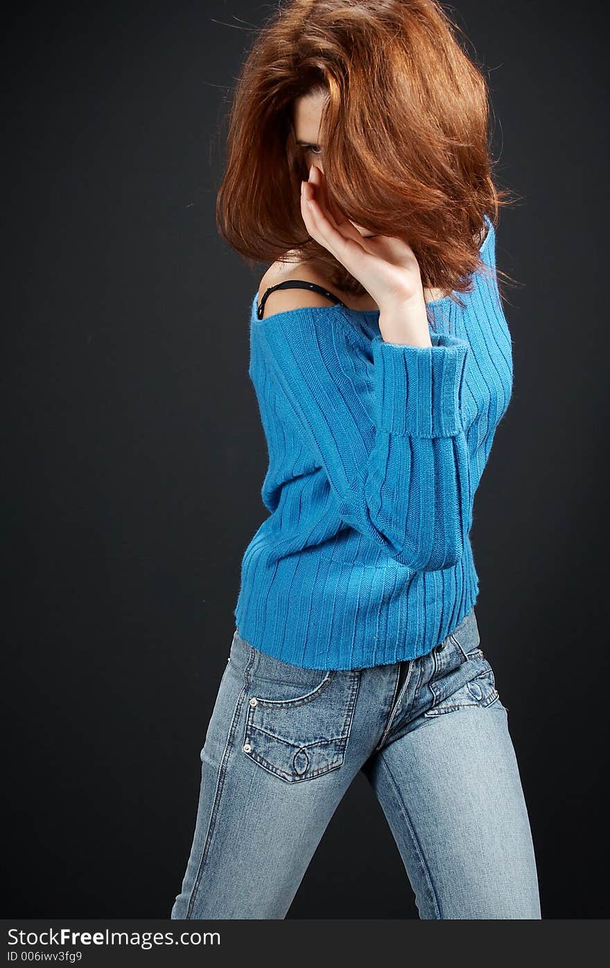 girl,in blue blouseand blue jeans, on black background. girl,in blue blouseand blue jeans, on black background