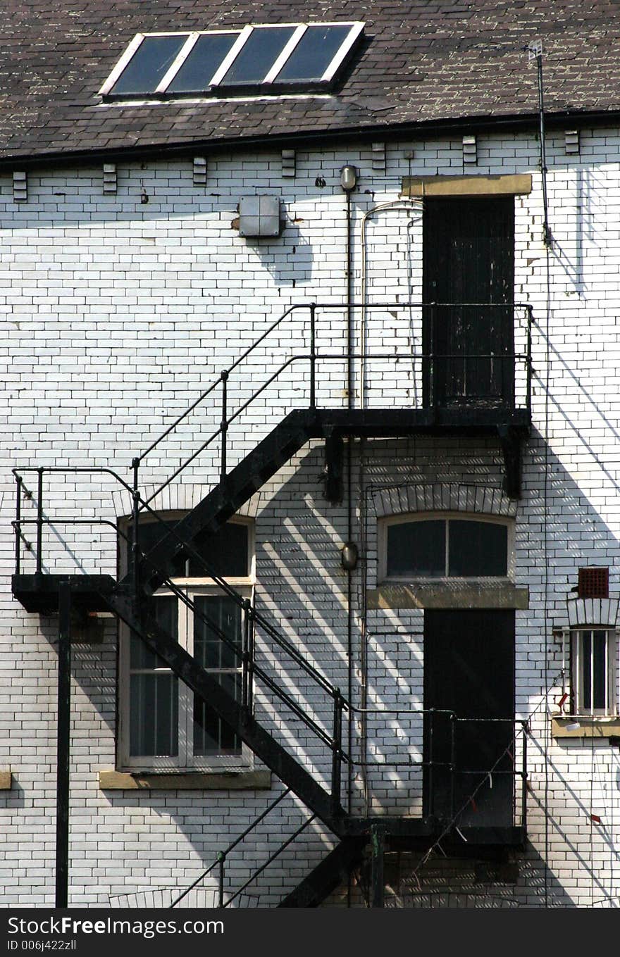 Warehouse fire escape on Leeds canal, West Yorkshire, UK