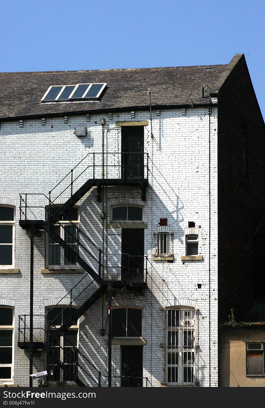 Warehouse fire escape on Leeds canal, West Yorkshire, UK