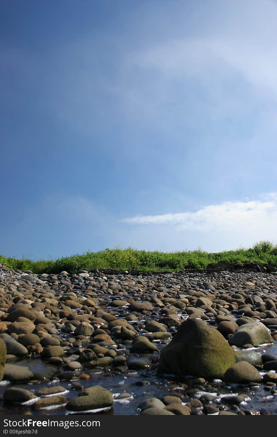 Stream Through A Rocky Beach