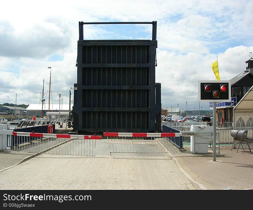 Road bridge is lifted to allow boats to enter the marina. Road bridge is lifted to allow boats to enter the marina