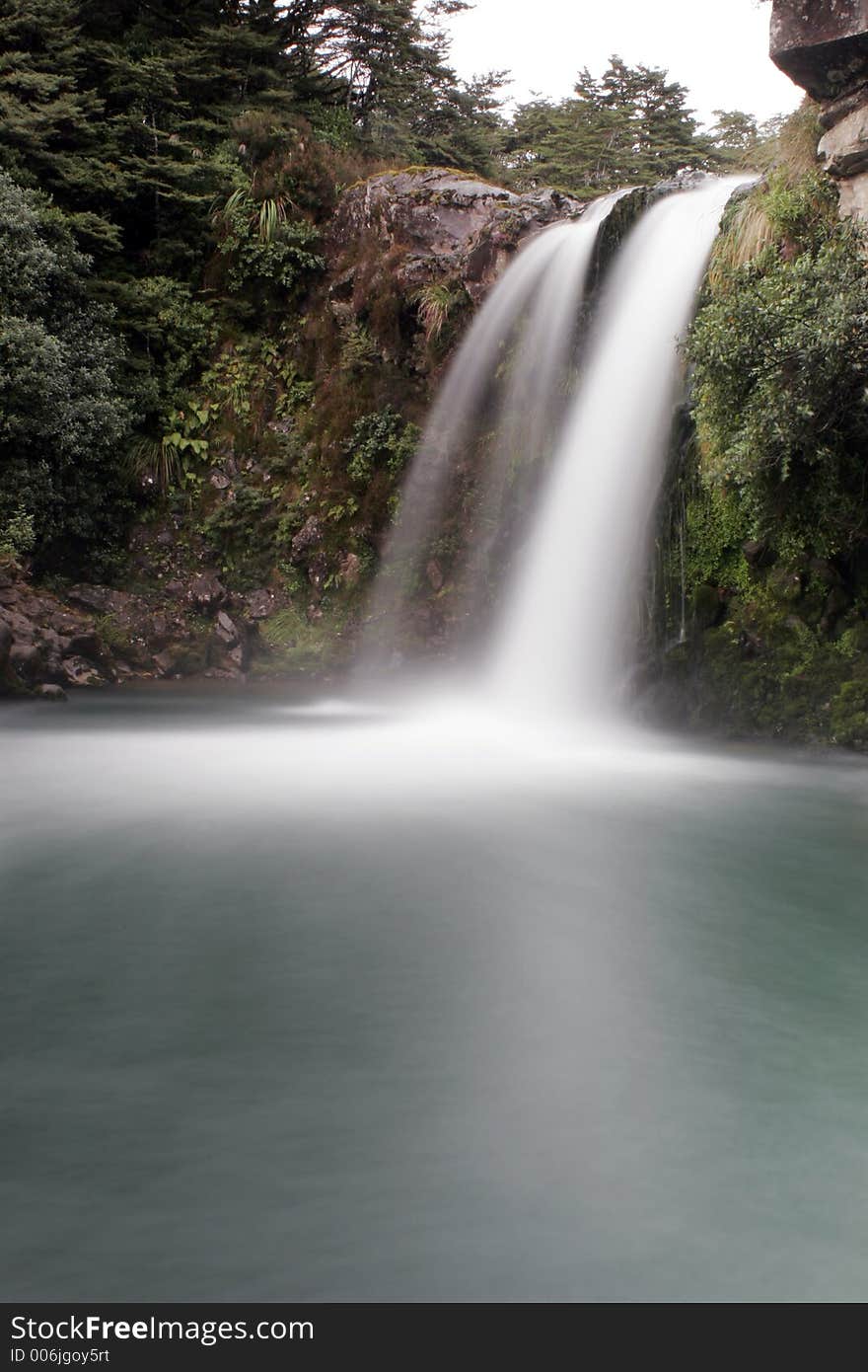 Waterfall flows into pool below