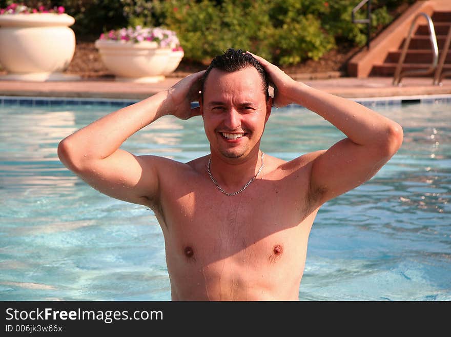 Man in pool posing. Man in pool posing