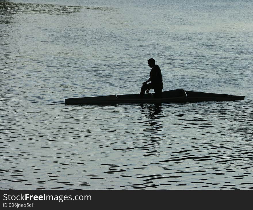 A men resting in the kayak. A men resting in the kayak