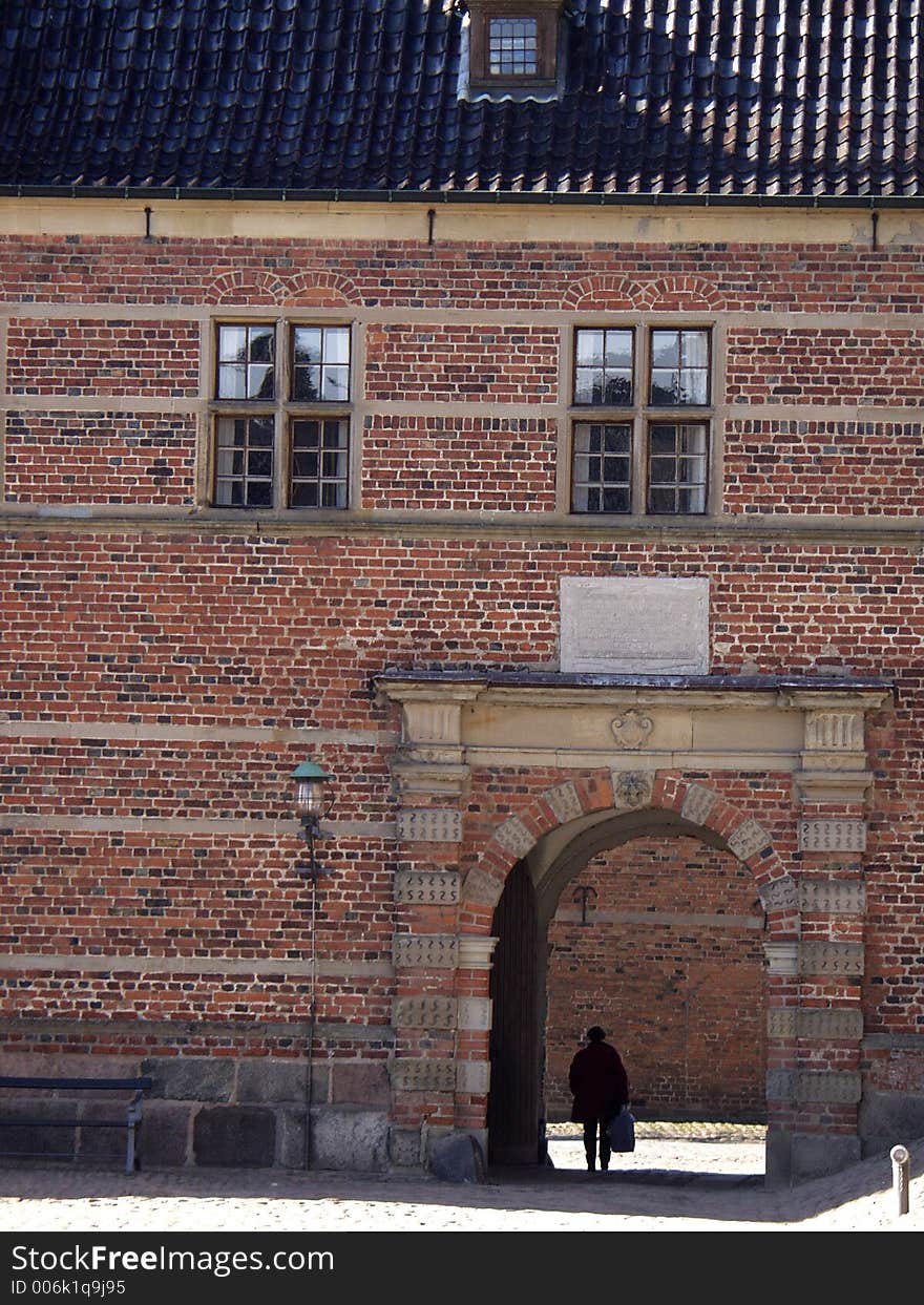 Castle of hilleroed in denmark (a sunny summer day with tourist and locals passing by). Castle of hilleroed in denmark (a sunny summer day with tourist and locals passing by)