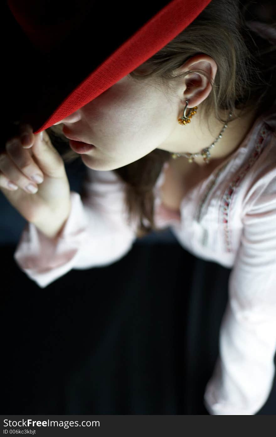 Girl with a red hat, close up. Girl with a red hat, close up