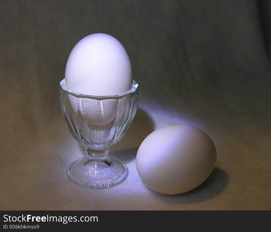 Eggs and the egg cup are the theme for breakfast.  Used lighting from flashlights to create this effect. Eggs and the egg cup are the theme for breakfast.  Used lighting from flashlights to create this effect.