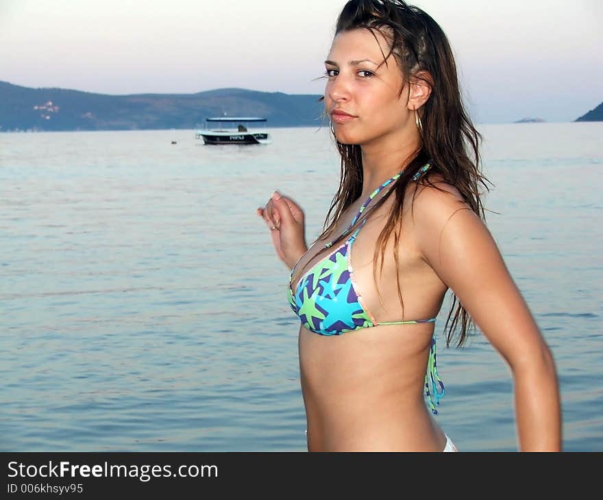 Attractive girl running by the sea