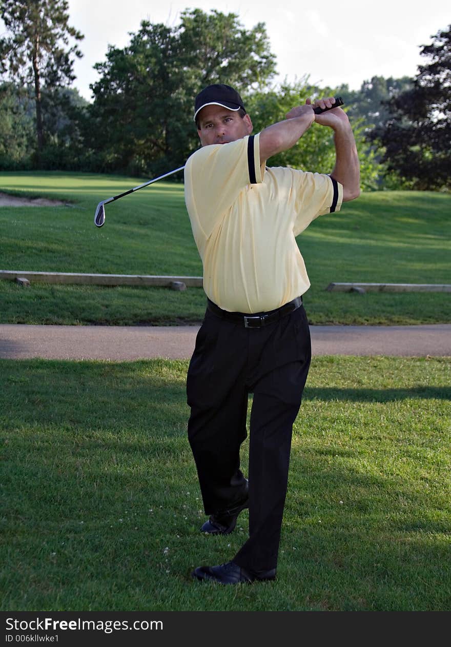 Man golfing. Man golfing.