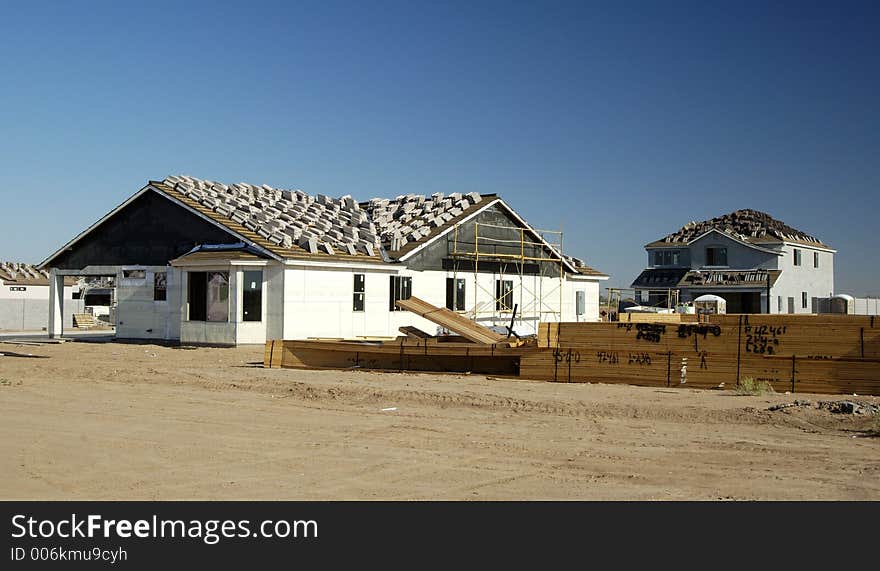 New home being built in a residential area. New home being built in a residential area.