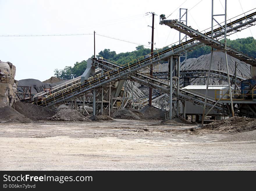 Multlple quarry conveyors with piles of coal and rock. Multlple quarry conveyors with piles of coal and rock