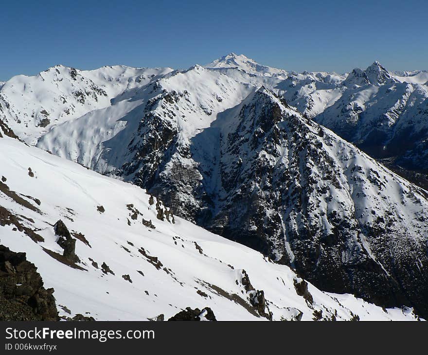 Snow-covered Mountain range in sunshine