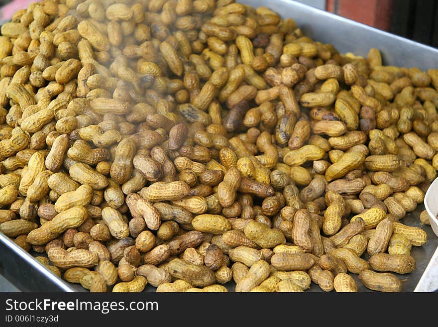 Steamed peanuts on a steaming tray at a highway stop